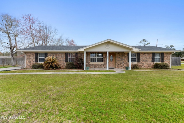 single story home featuring a shingled roof, fence, a front lawn, and brick siding