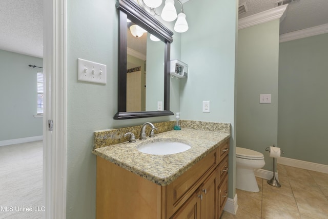 bathroom featuring a textured ceiling, visible vents, and crown molding