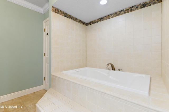 bathroom featuring baseboards, tile patterned floors, crown molding, a textured ceiling, and a bath