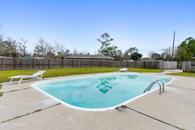 view of swimming pool with a yard, a patio, a fenced backyard, and a fenced in pool