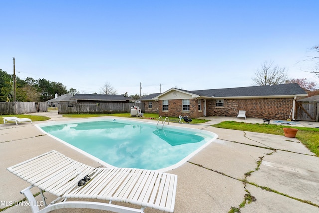 view of pool featuring a patio area, a fenced backyard, and a fenced in pool