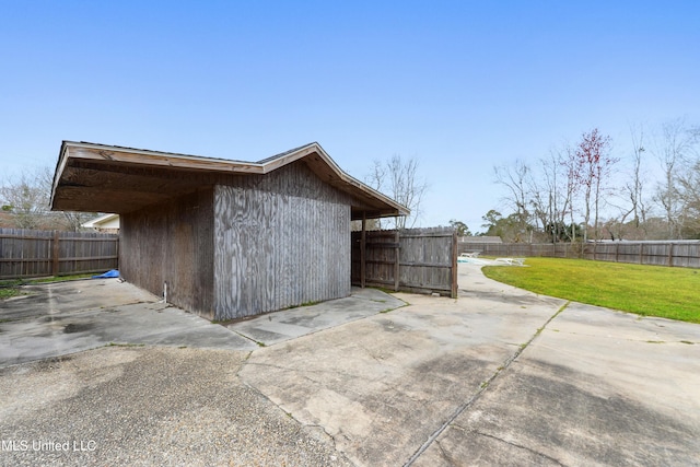 view of outbuilding featuring a fenced backyard and an outbuilding