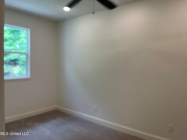 carpeted empty room with ceiling fan