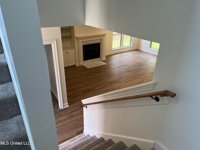 staircase featuring hardwood / wood-style flooring