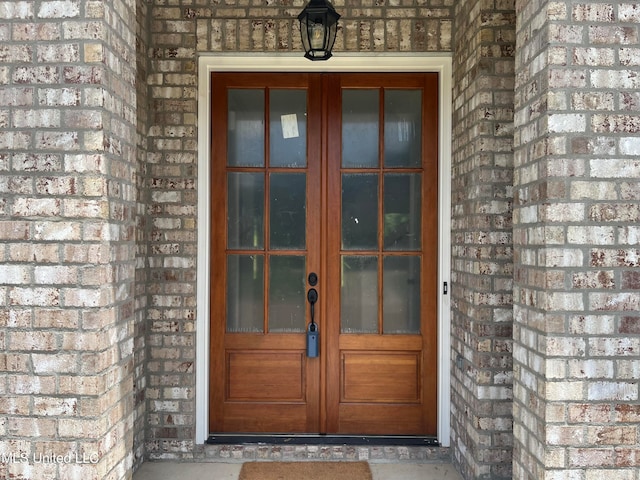 view of exterior entry featuring french doors