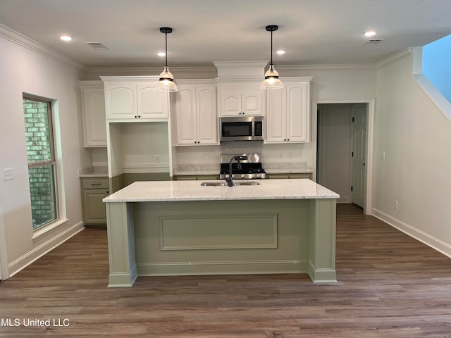 kitchen with white cabinetry, light stone countertops, stainless steel appliances, and sink