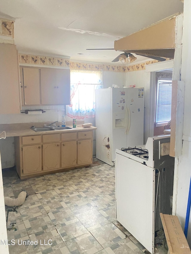 810 S Edwards Ave, Clarksdale, MS 38614 - kitchen with light floors, white appliances, light countertops, ceiling fan, and a sink