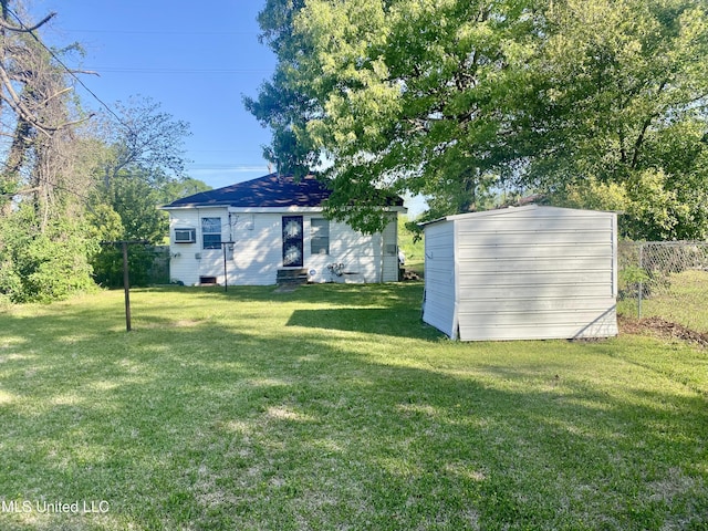 810 S Edwards Ave, Clarksdale, MS 38614 - view of front facade with a front yard, fence, and an outdoor structure