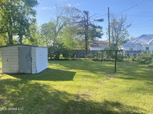 810 S Edwards Ave, Clarksdale, MS 38614 - view of yard featuring a storage shed, fence, and an outdoor structure