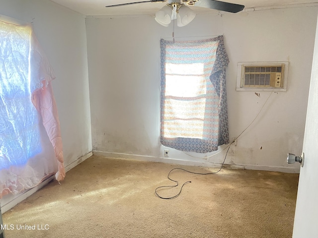 810 S Edwards Ave, Clarksdale, MS 38614 - unfurnished room with carpet flooring, baseboards, a wall unit AC, and a ceiling fan