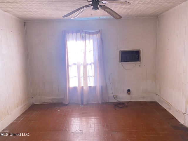 810 S Edwards Ave, Clarksdale, MS 38614 - spare room featuring wooden walls, ceiling fan, brick patterned floor, and a wall unit AC