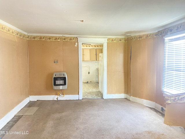 810 S Edwards Ave, Clarksdale, MS 38614 - carpeted empty room featuring baseboards, heating unit, and a healthy amount of sunlight