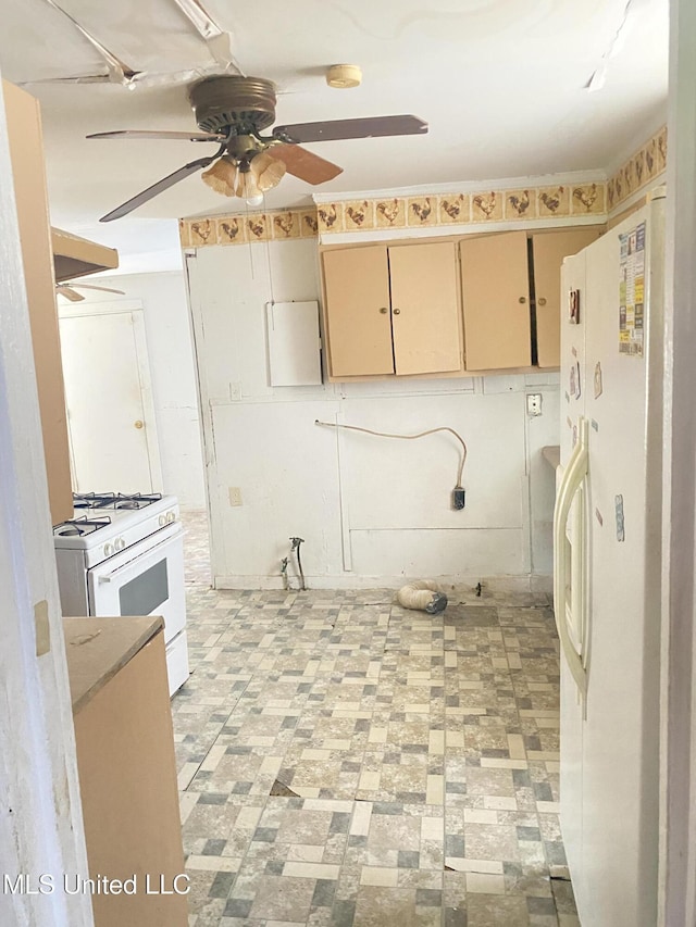 810 S Edwards Ave, Clarksdale, MS 38614 - kitchen with cream cabinetry, ceiling fan, and white appliances