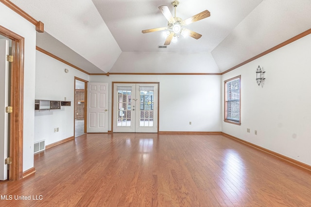 unfurnished living room featuring french doors, vaulted ceiling, ceiling fan, and wood-type flooring