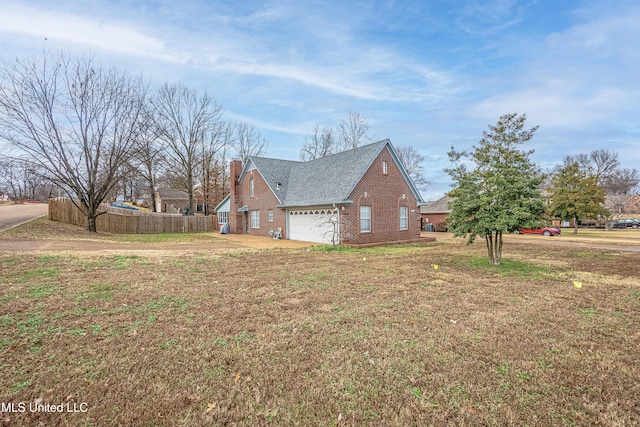 view of side of home featuring a lawn