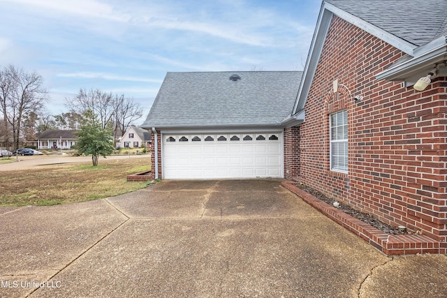 view of property exterior featuring a garage and a lawn