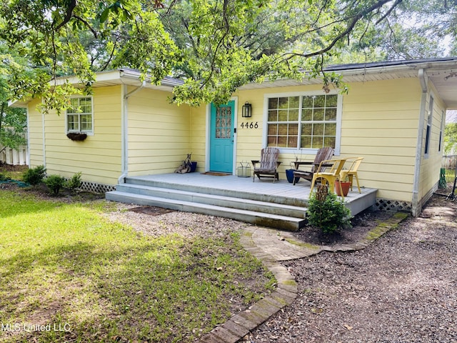 4466 Beatline Rd, Long Beach, MS 39560 - rear view of house featuring a lawn