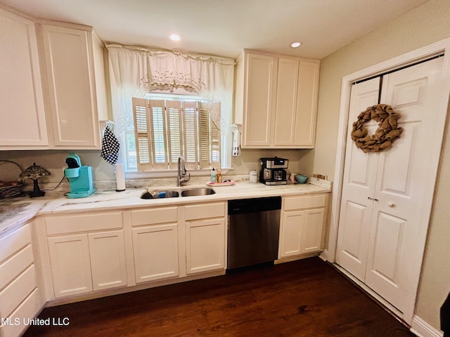 4466 Beatline Rd, Long Beach, MS 39560 - kitchen featuring white cabinets, dark wood-style flooring, a sink, light countertops, and stainless steel dishwasher
