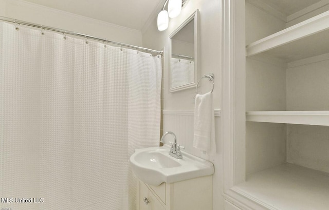 4466 Beatline Rd, Long Beach, MS 39560 - bathroom with vanity, ornamental molding, and a wainscoted wall