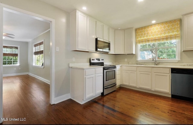 4466 Beatline Rd, Long Beach, MS 39560 - kitchen featuring baseboards, a sink, dark wood finished floors, appliances with stainless steel finishes, and a wealth of natural light