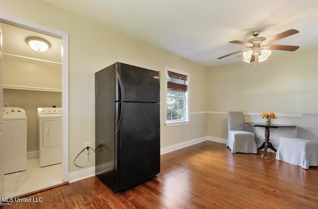 4466 Beatline Rd, Long Beach, MS 39560 - kitchen featuring freestanding refrigerator, a ceiling fan, baseboards, wood finished floors, and washer and clothes dryer