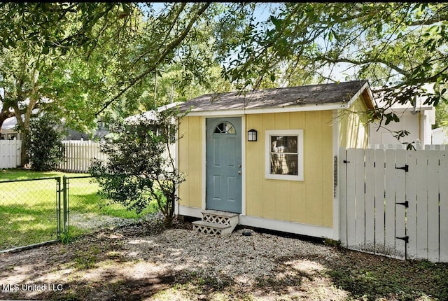 4466 Beatline Rd, Long Beach, MS 39560 - view of outdoor structure featuring fence, a gate, and an outbuilding