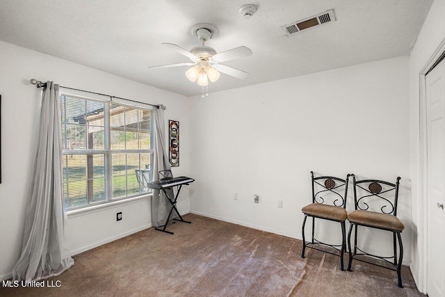 1085 Thomas Dr, Raymond, MS 39154 - miscellaneous room with a ceiling fan, carpet floors, and baseboards