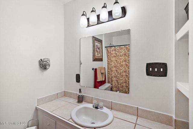 bathroom with vanity and tile patterned flooring