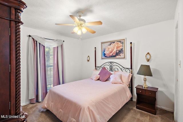 1085 Thomas Dr, Raymond, MS 39154 - carpeted bedroom with a ceiling fan, baseboards, and a textured ceiling