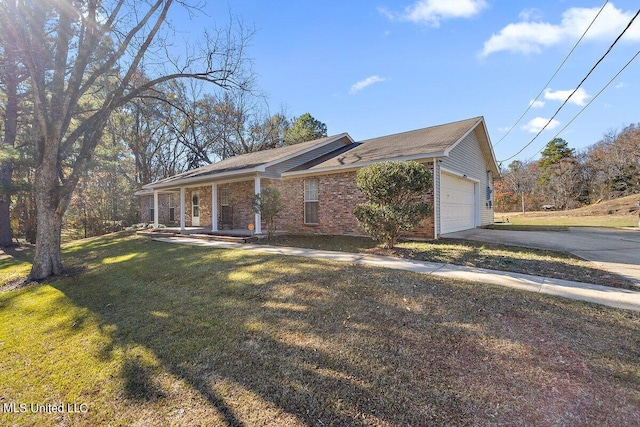 view of front of home with a front yard, a garage, and covered porch