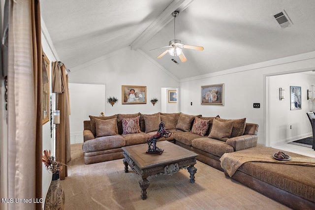 living room with ceiling fan, lofted ceiling with beams, a textured ceiling, and light carpet