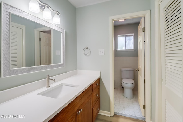 bathroom with vanity and toilet