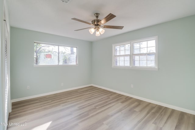 unfurnished room featuring ceiling fan and light hardwood / wood-style floors