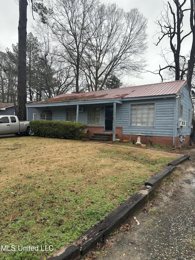 ranch-style home with a front lawn