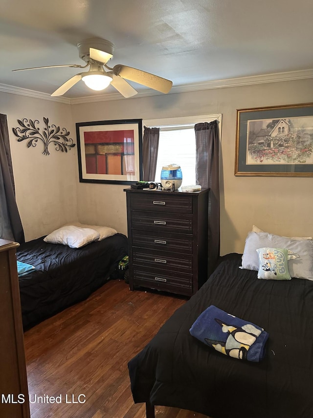 bedroom with ceiling fan, dark wood-type flooring, and crown molding