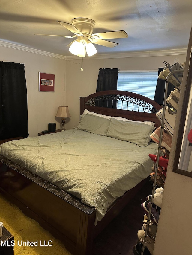 bedroom featuring ceiling fan and ornamental molding