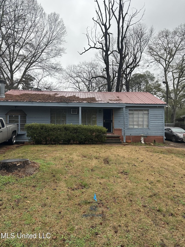 single story home with a front yard