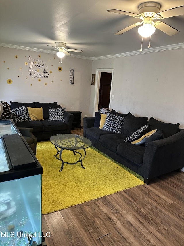 living room featuring ceiling fan, wood-type flooring, and crown molding