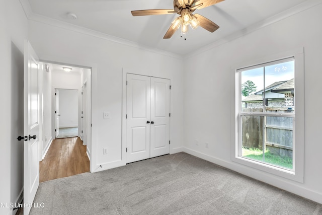 202 Crestwood Pl, Madison, MS 39110 - unfurnished bedroom featuring carpet flooring, crown molding, a closet, and ceiling fan