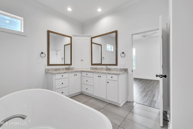 202 Crestwood Pl, Madison, MS 39110 - bathroom with a freestanding bath, double vanity, tile patterned floors, healthy amount of natural light, and ornamental molding