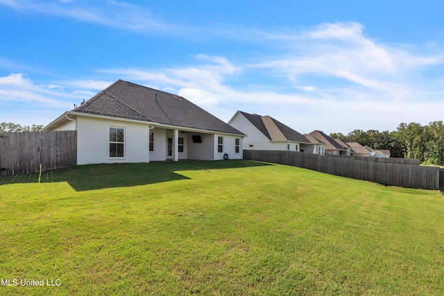 202 Crestwood Pl, Madison, MS 39110 - rear view of property featuring a fenced backyard, brick siding, and a shingled roof