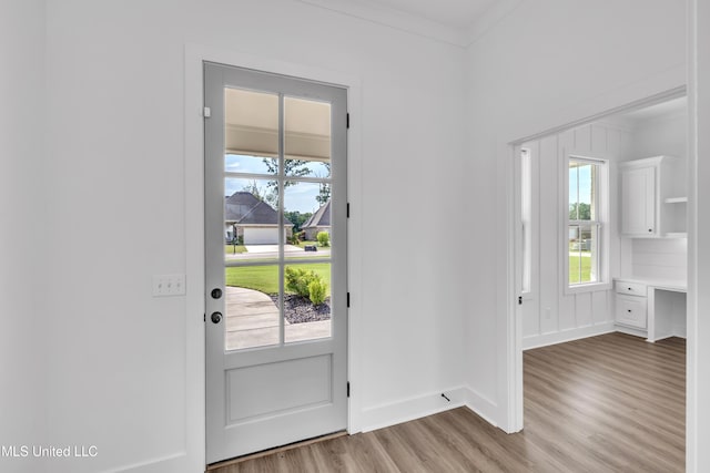 202 Crestwood Pl, Madison, MS 39110 - doorway with light wood-style floors and crown molding