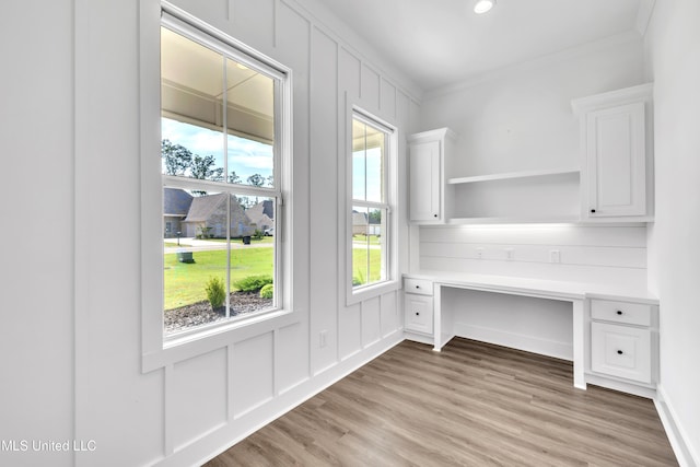 202 Crestwood Pl, Madison, MS 39110 - unfurnished office featuring crown molding, light wood-style floors, a decorative wall, and recessed lighting