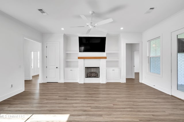 202 Crestwood Pl, Madison, MS 39110 - unfurnished living room featuring ceiling fan, light wood-style flooring, a fireplace, recessed lighting, and ornamental molding