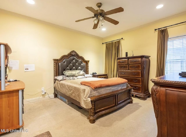 bedroom with crown molding, light carpet, and ceiling fan