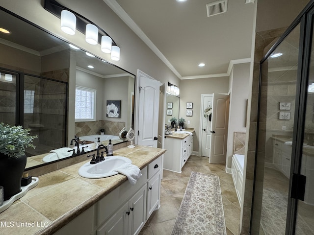 bathroom featuring tile patterned floors, ornamental molding, shower with separate bathtub, and vanity