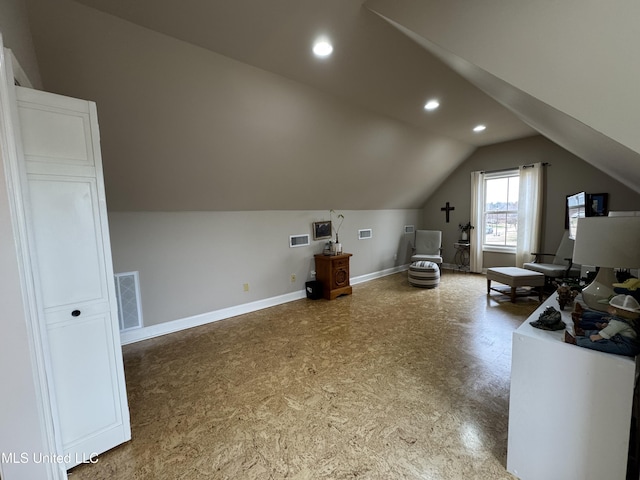 additional living space with vaulted ceiling