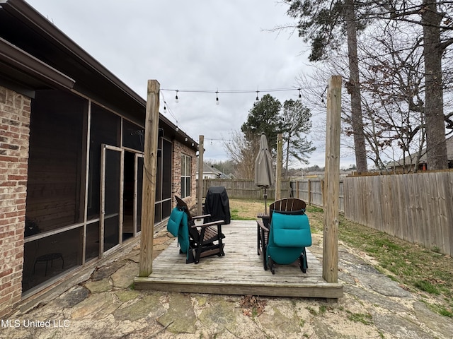 exterior space with area for grilling and a sunroom