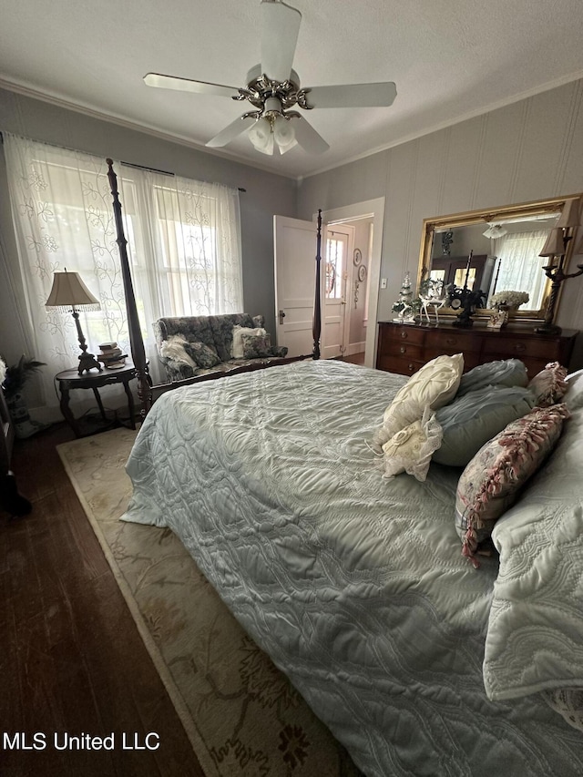 209 S Jackson St, Crystal Springs, MS 39059 - bedroom with wood finished floors, ceiling fan, and ornamental molding