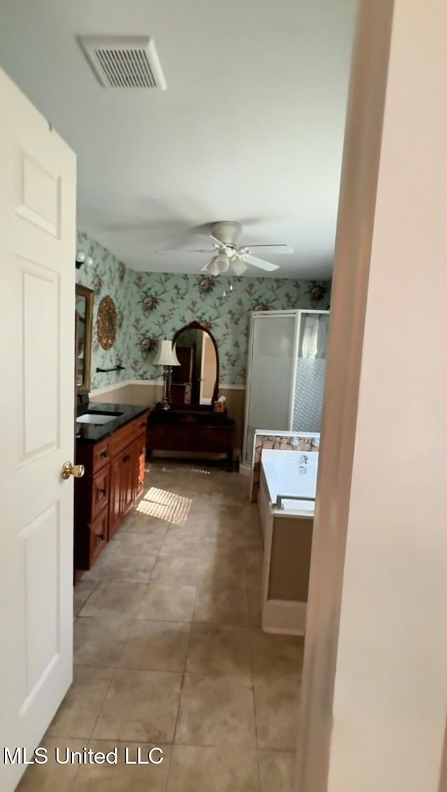 209 S Jackson St, Crystal Springs, MS 39059 - bathroom with a stall shower, visible vents, wallpapered walls, and vanity